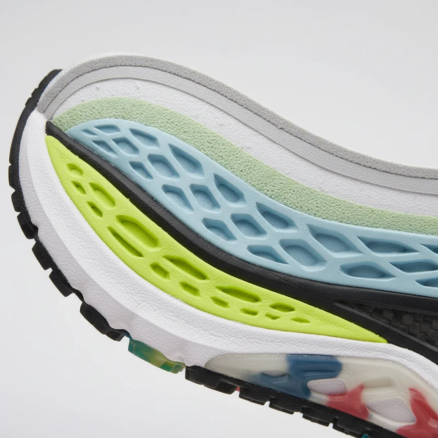 Close-up cross-section of a New Balance shoe sole, illustrating various cushioning layers and technologies like Fresh Foam or ENCAP.